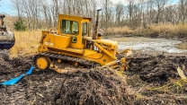 How many OLD BULLDOZERS do we need to clean out a pond??