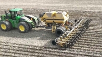 CANADIAN FARMER - MASSIVE STRIP TILLER - Soil Warrior 4550XDXX2 16 row prepping  spring corn plant.